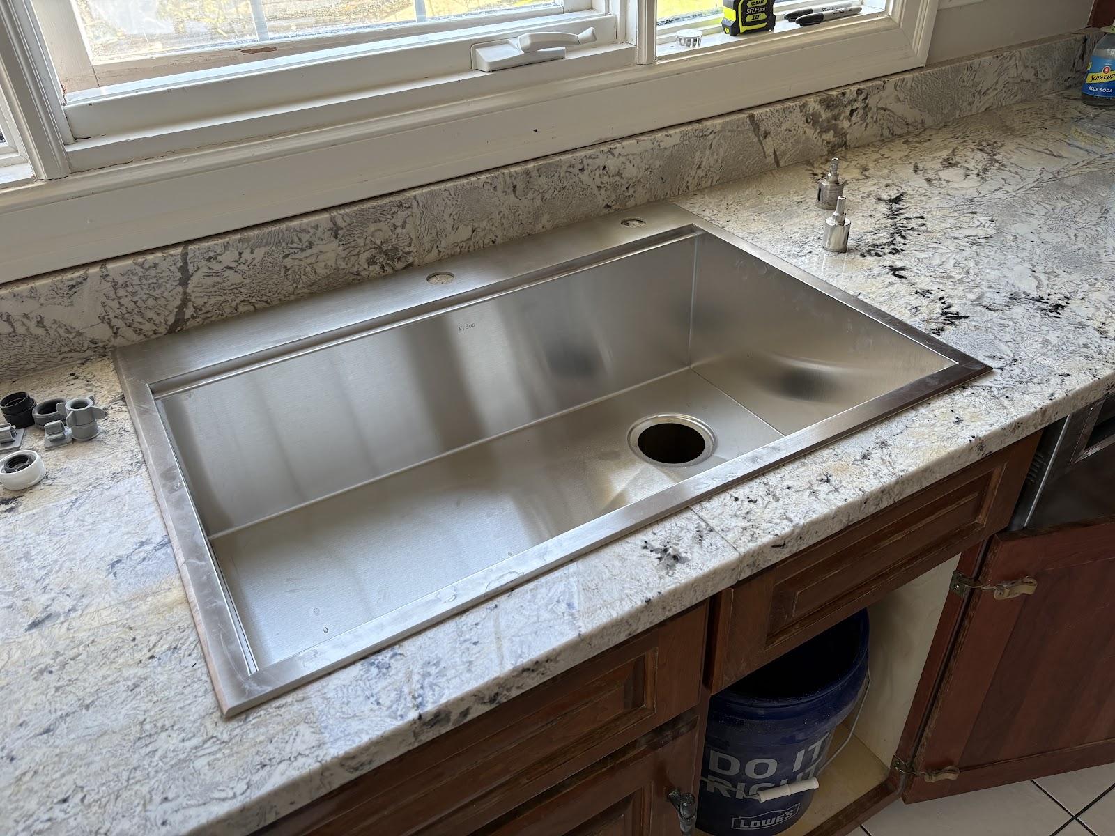 Undermount stainless sink set in granite
